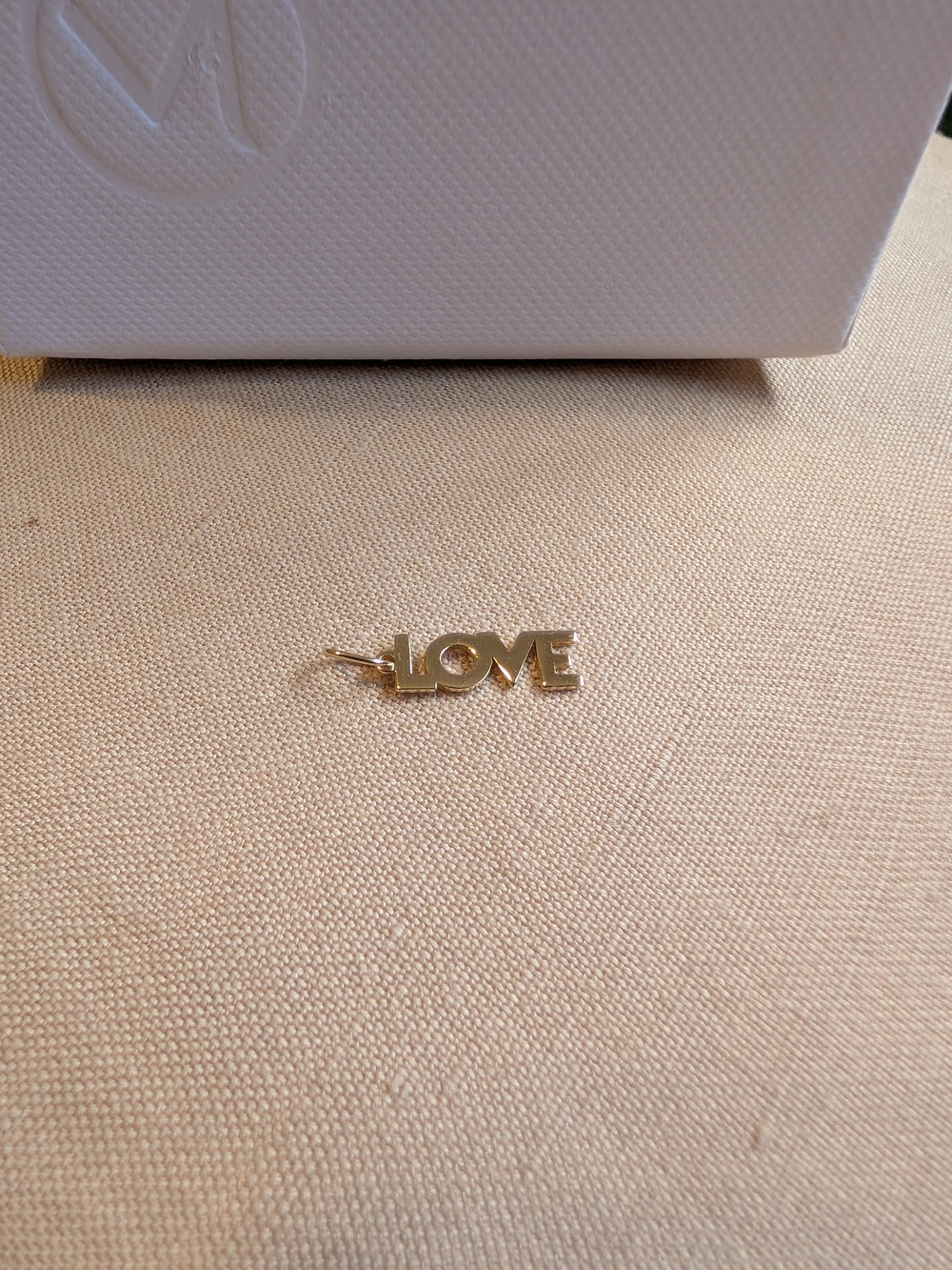 Mejuri 14k "LOVE" pendant.